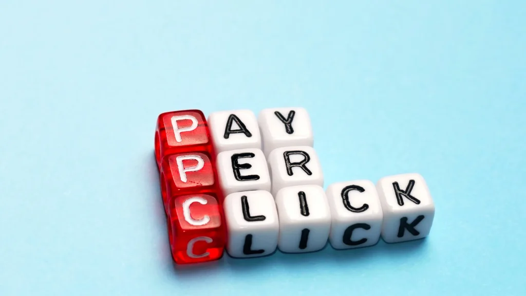 PPC campaign strategy shown with dice spelling 'Pay Per Click